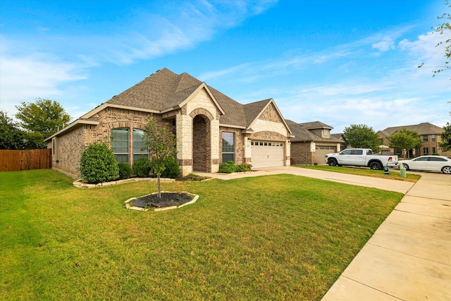 view of front facade with a front yard and a garage