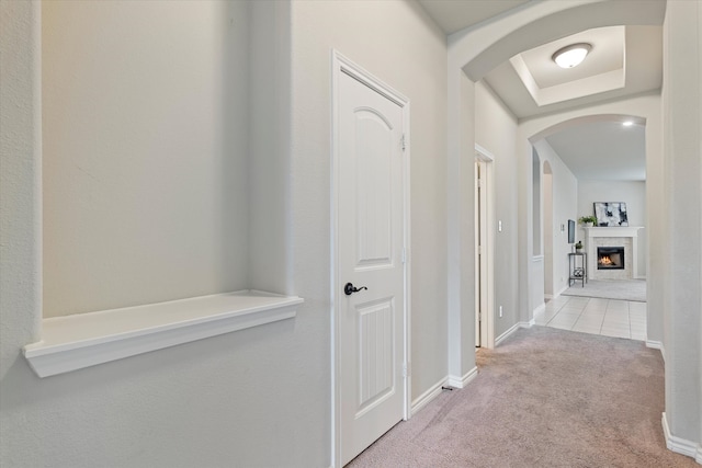 corridor with light colored carpet