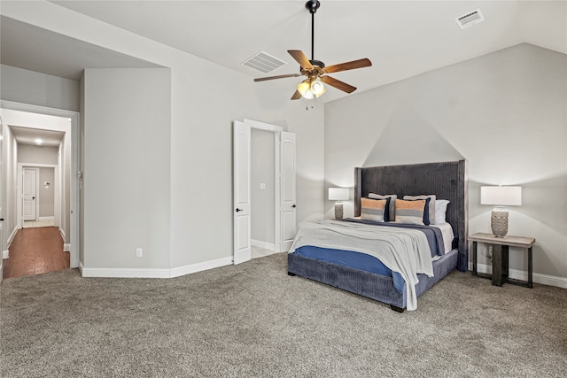 bedroom with vaulted ceiling, carpet, and ceiling fan