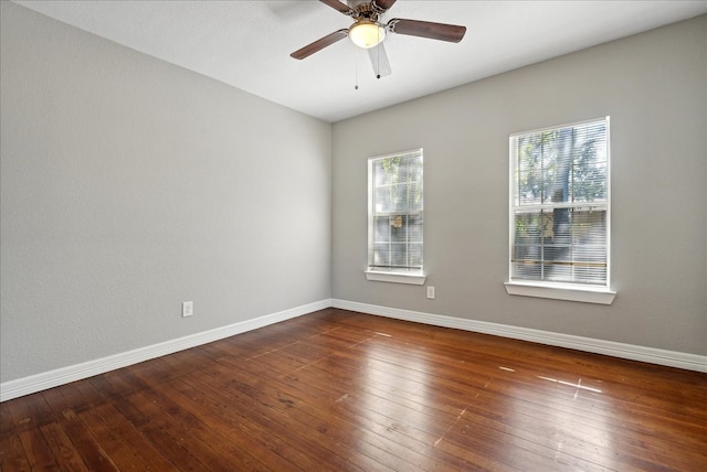 unfurnished room with ceiling fan and dark hardwood / wood-style floors