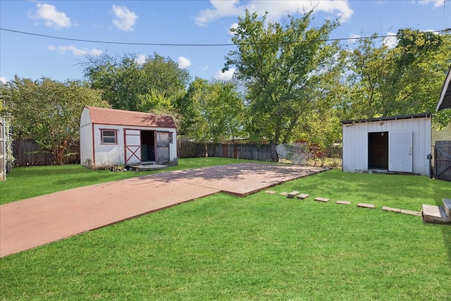 view of yard with a patio area and a storage shed