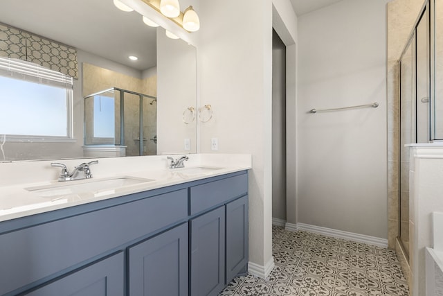 bathroom with vanity, a shower with door, and tile patterned flooring