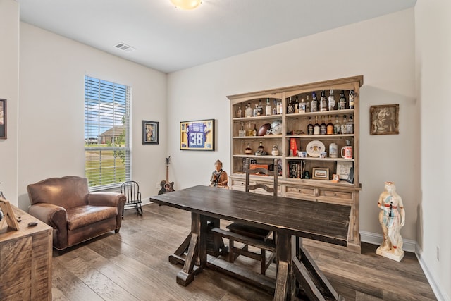 home office with hardwood / wood-style flooring