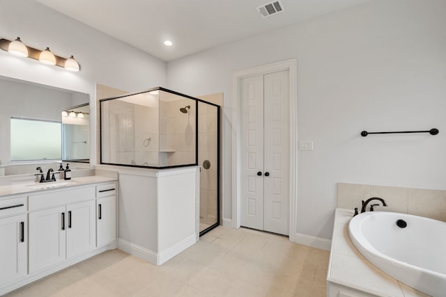 bathroom with vanity, tile patterned flooring, and separate shower and tub