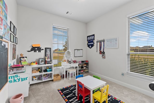 playroom with light colored carpet