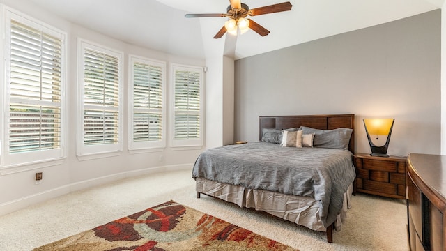 bedroom with ceiling fan and light colored carpet