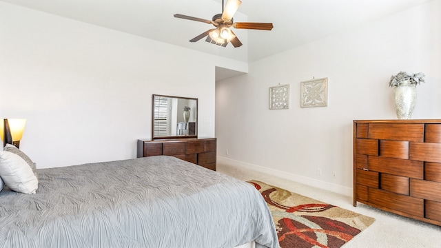 bedroom with light carpet and ceiling fan