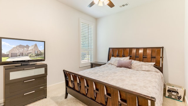 bedroom with ceiling fan and light colored carpet