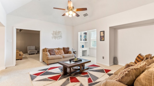 carpeted living room featuring vaulted ceiling and ceiling fan