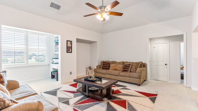 living room with light colored carpet and ceiling fan