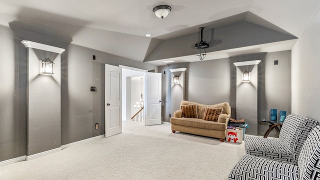 living area featuring carpet floors and vaulted ceiling