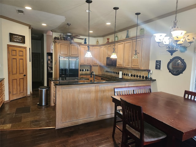 kitchen featuring decorative backsplash, dark hardwood / wood-style floors, kitchen peninsula, stainless steel fridge with ice dispenser, and pendant lighting