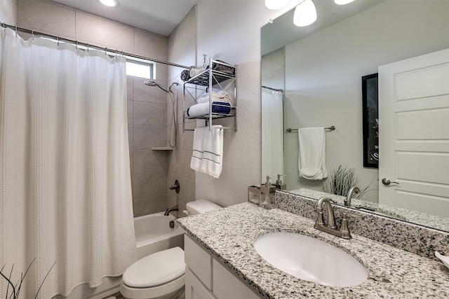 bathroom featuring shower / tub combo, vanity, and toilet