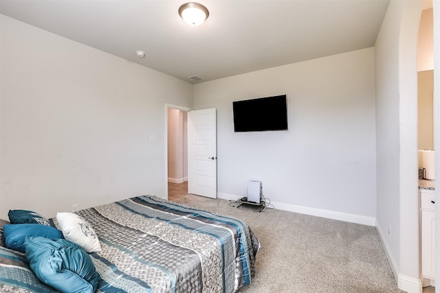 bedroom with carpet, visible vents, and baseboards