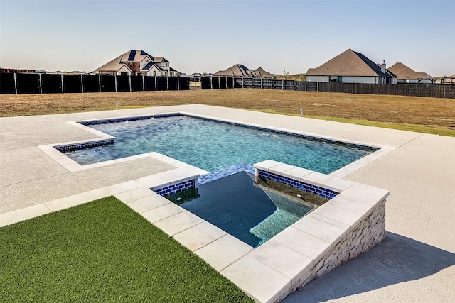 view of swimming pool with a yard, a fenced backyard, and a pool with connected hot tub