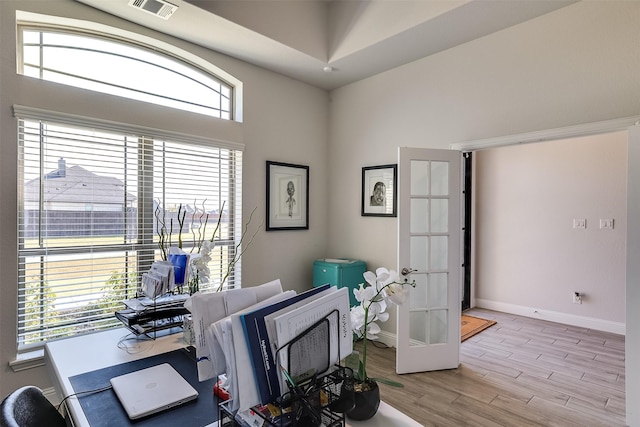 home office featuring plenty of natural light and french doors