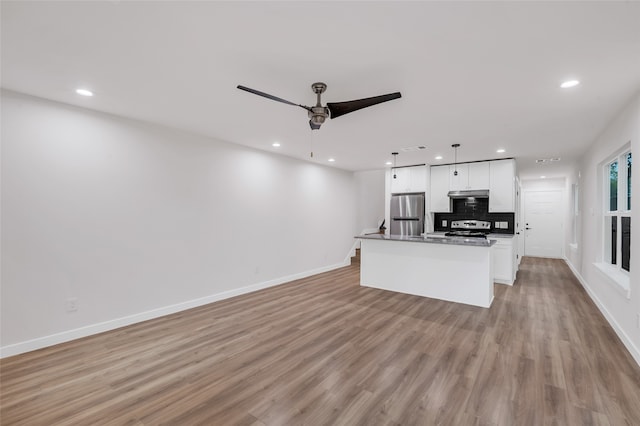 living room featuring ceiling fan and light wood-type flooring