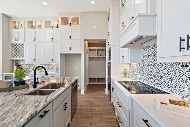 kitchen with white cabinetry, appliances with stainless steel finishes, sink, and dark hardwood / wood-style floors