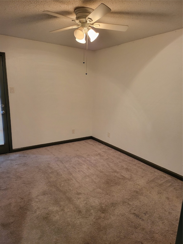 unfurnished room featuring a textured ceiling, light colored carpet, and ceiling fan