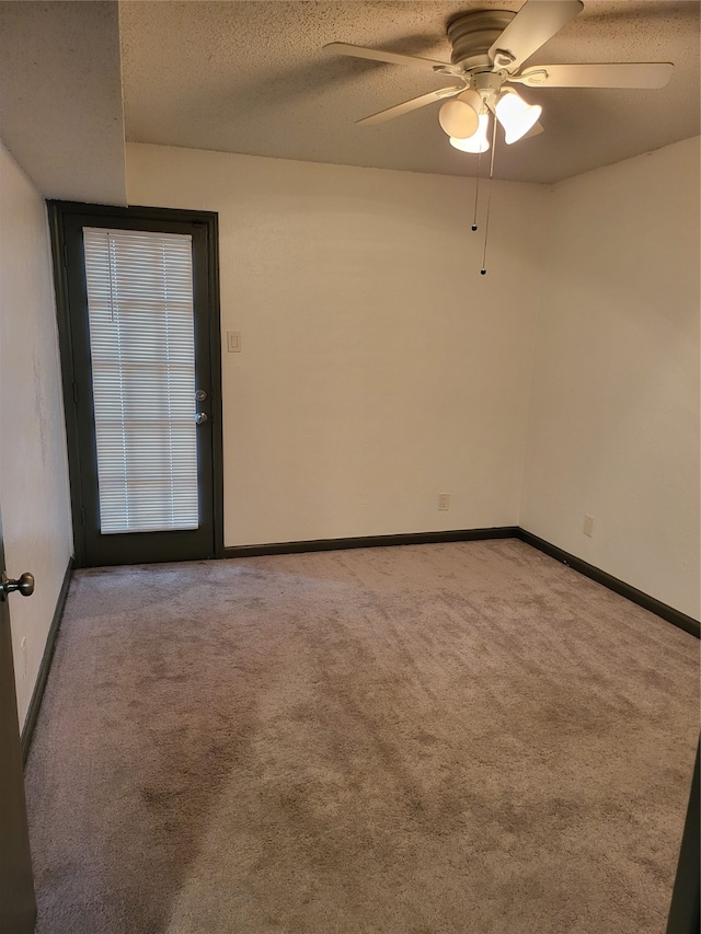 unfurnished room with light carpet, a textured ceiling, and ceiling fan