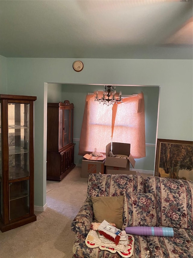 interior space with a notable chandelier, light colored carpet, and a wealth of natural light