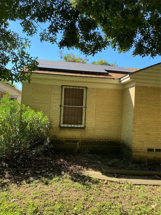 view of home's exterior featuring solar panels