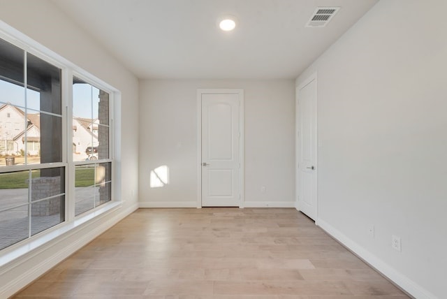 unfurnished room featuring light wood-type flooring