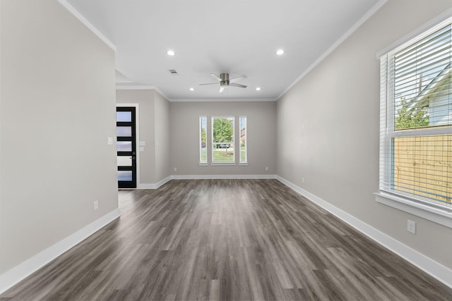 unfurnished room with dark hardwood / wood-style flooring, ceiling fan, and crown molding