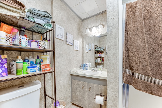 bathroom featuring vanity and toilet