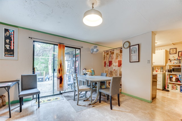 dining room with a textured ceiling