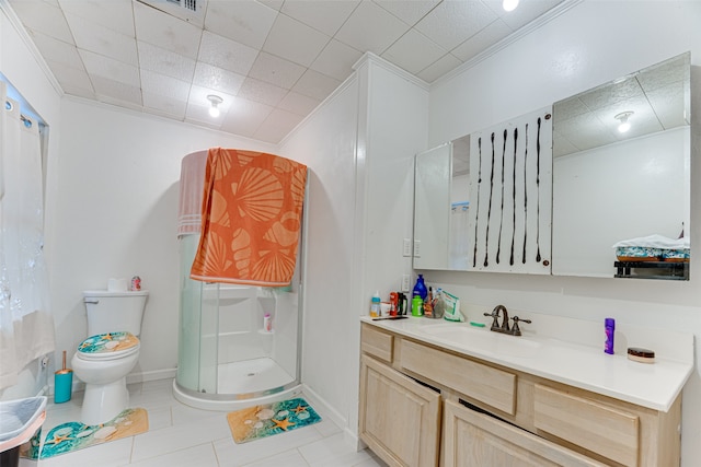 bathroom featuring toilet, ornamental molding, a shower with shower door, vanity, and tile patterned flooring