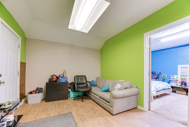 interior space featuring lofted ceiling and wood-type flooring