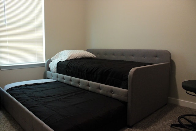 bedroom featuring light colored carpet