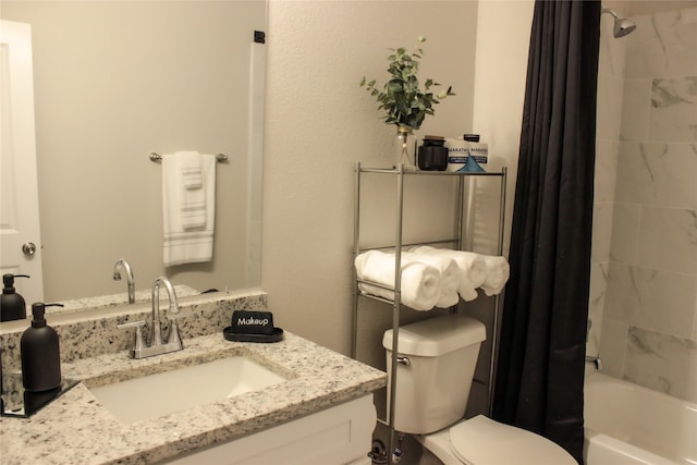 full bathroom featuring vanity, shower / tub combo with curtain, and toilet