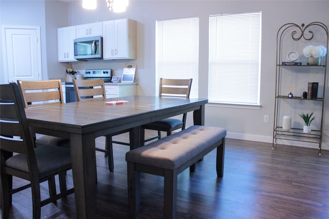 dining area featuring dark hardwood / wood-style floors