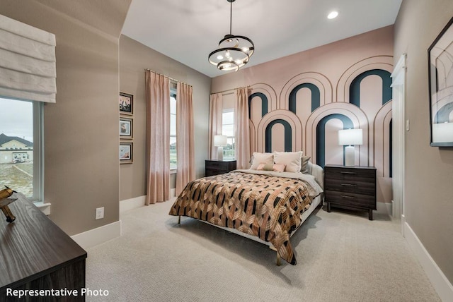 carpeted bedroom featuring a notable chandelier, recessed lighting, and baseboards