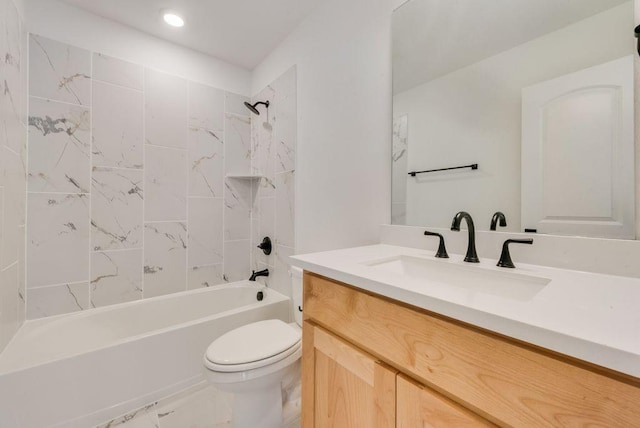 bathroom with shower / bathtub combination, vanity, and toilet