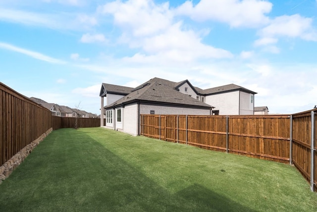 view of yard featuring a fenced backyard