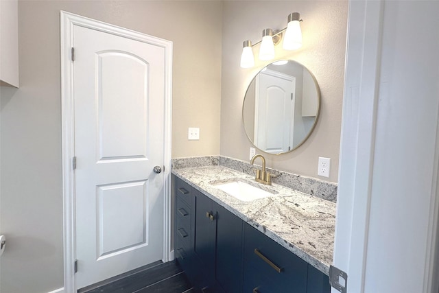 bathroom featuring hardwood / wood-style flooring and vanity