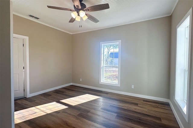 empty room featuring crown molding, ceiling fan, and dark hardwood / wood-style floors