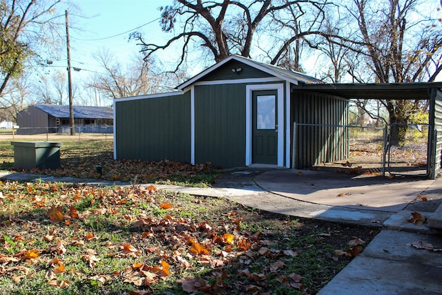 view of outbuilding featuring a carport