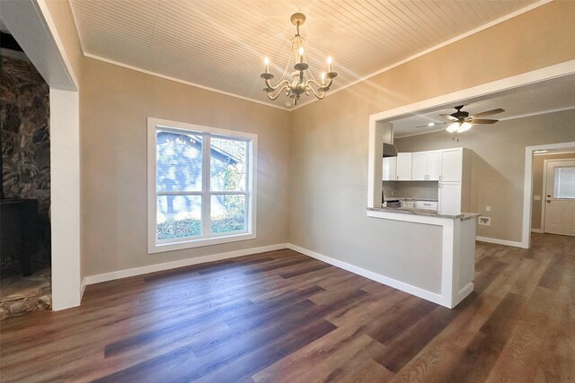 unfurnished dining area featuring crown molding, dark hardwood / wood-style flooring, and ceiling fan with notable chandelier