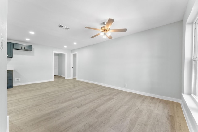 empty room with visible vents, baseboards, ceiling fan, recessed lighting, and light wood-style flooring