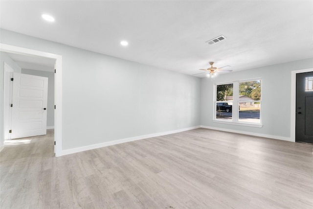 unfurnished living room with visible vents, baseboards, light wood-style floors, and ceiling fan