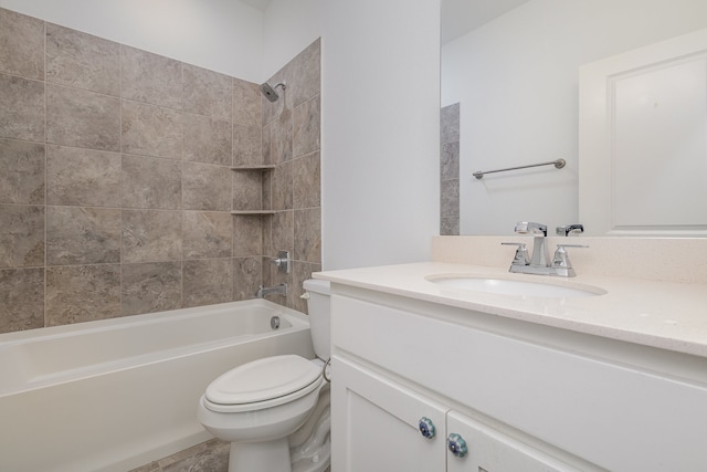 full bathroom featuring vanity, toilet, and tiled shower / bath