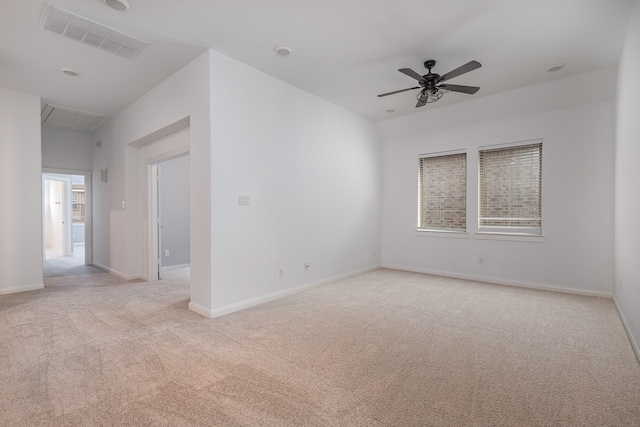 empty room featuring light carpet and ceiling fan