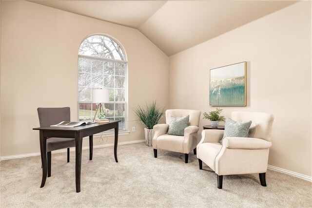 empty room with lofted ceiling, an inviting chandelier, and carpet flooring