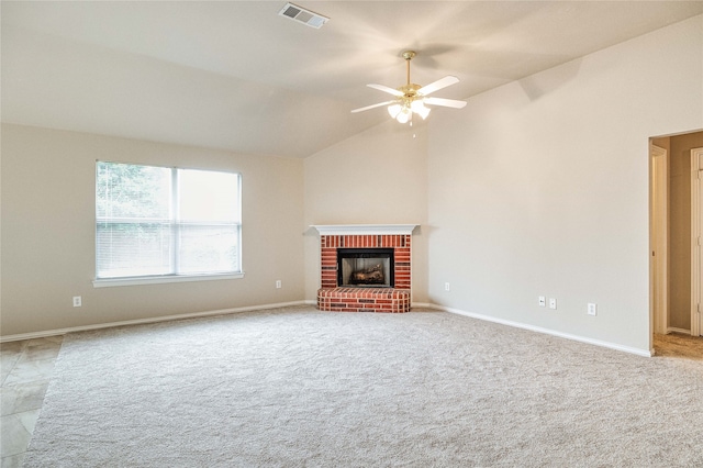 unfurnished living room with a brick fireplace, light carpet, ceiling fan, and vaulted ceiling