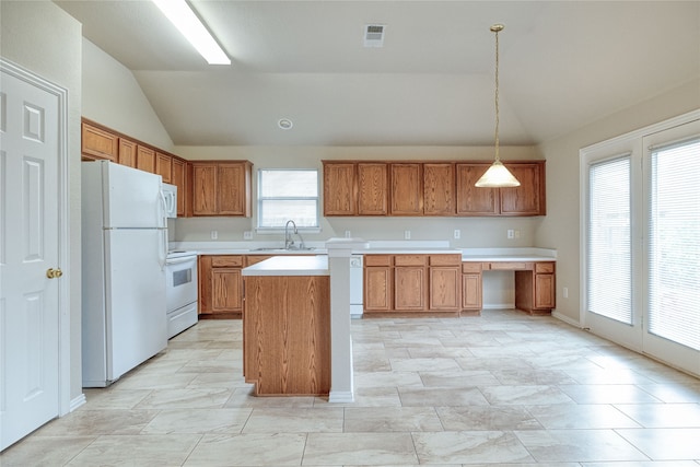 kitchen featuring a center island, vaulted ceiling, hanging light fixtures, sink, and white appliances