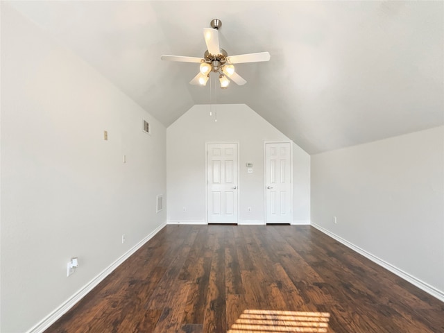 additional living space with vaulted ceiling, ceiling fan, and dark hardwood / wood-style flooring